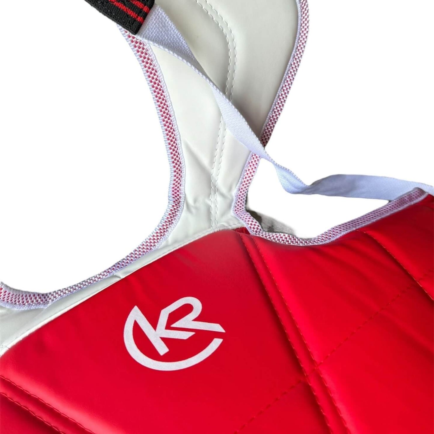 Close-up of Krolin SHIELD-PRO body protector – padded martial arts chest gear with secure tie straps and reinforced stitching.